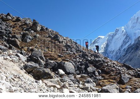 Porters Over A Difficult Pass Near Gorak Shep, Everest Base Camp Trek, Nepal