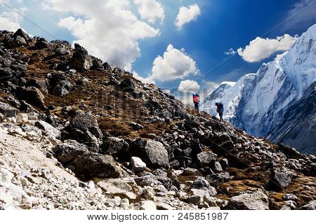Porters Over A Difficult Pass Near Gorak Shep, Everest Base Camp Trek, Nepal