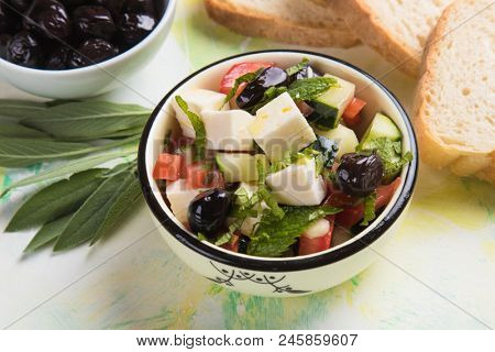 Greek salad with feta cheese cubes and fresk vegetables