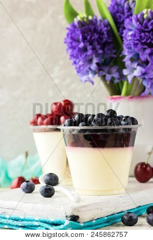 Italian Dessert Pana Cota With Berry Jam And Fresh Blueberries