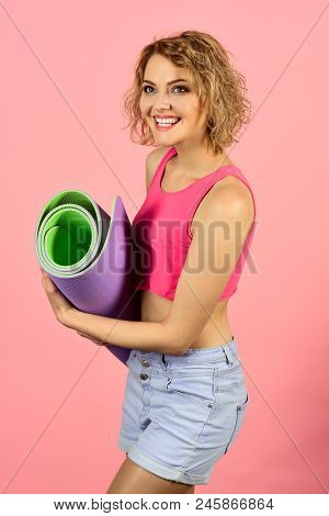 Health And Body Care. Sport Concept. Happy Fitness Woman Holds Yoga Mat. Sports Woman Holds Rolled U