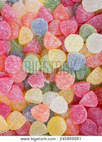 Jelly Marmalade Candies Of Various Colors In Shape Of Gems. Vivid Multicolored Palette Orange Yellow