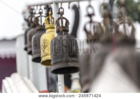 Many Tranditional Wind Chime On Strings In A Row With Bokeh Background