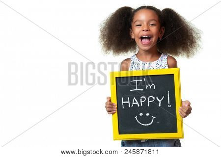 Cute african american girl laughing and holding a sign with a happy phrase - Isolated on white