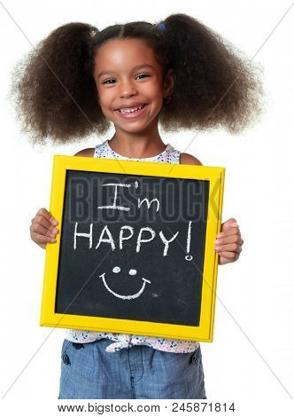 Cute african american girl laughing and holding a sign with a happy phrase - Isolated on white