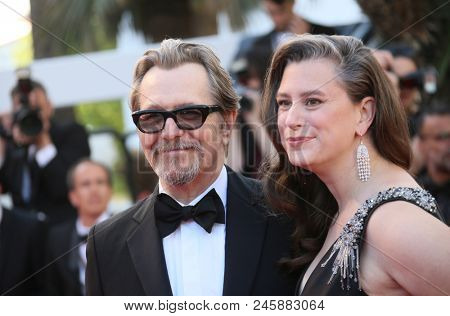 Gary Oldman and Gisele Schmidt attend the screening of 'Capharnaum' during the 71st annual Cannes Film Festival at Palais des Festivals on May 17, 2018 in Cannes, France.