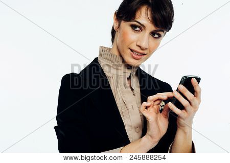Young Caucasian Brunette Suit Dressed Business Woman Chatting With A Vintage Smartphone. Standing Up