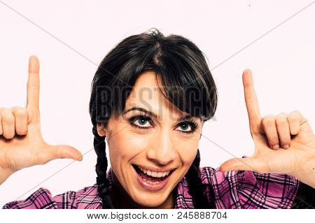 Young Caucasian Brunette Holding A Fake Tv Set Top Box. Promo. White Background Studio Shot. Pink Sh