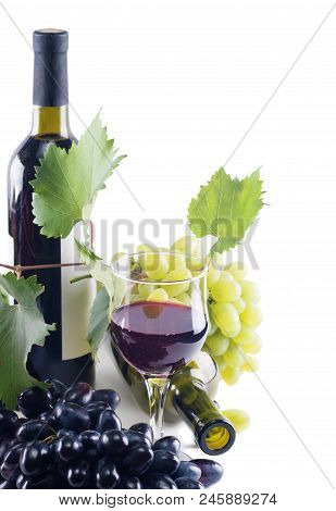 Bottle Of Wine, Grapes And A Glass Of Red Wine On A White Background