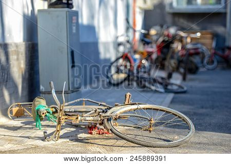 Beijing, China - March 10, 2016: Bicycles, Scooters And Cars In Beijing Streets. There Are Many Diff
