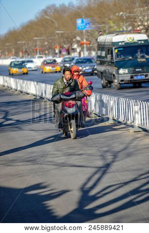 Beijing, China - March 10, 2016: There Are Many Different Motorcycles And Bicycles On The Streets Of