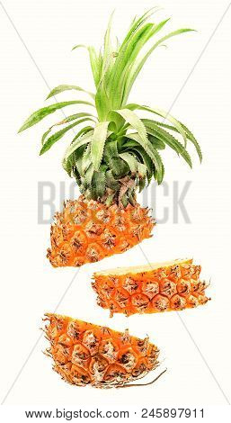 Creative Concept With Flying Pineapple. Sliced Pineapple Isolated On White Background. Levity Fruit 