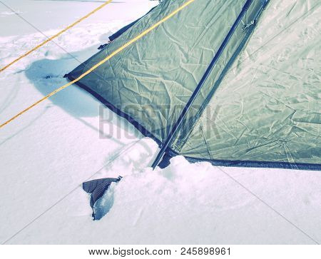Rope On A Camp Tent, Detail Of Anchored Tent In Snowy Ground Within Extreme Mountain Trail.