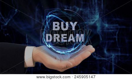 Painted Hand Shows Concept Hologram Buy Dream On His Hand. Drawn Man In Business Suit With Future Te