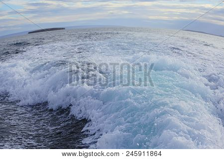 Beautiful View Of Boiling Green Sea Water With Turning Wave In Foreground And Marta Island In Horizo
