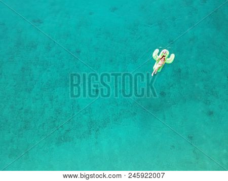 Aerial View Young Woman On Giant Inflated Cactus Float In Turquois Water Of Ionian Sea Albania Top V