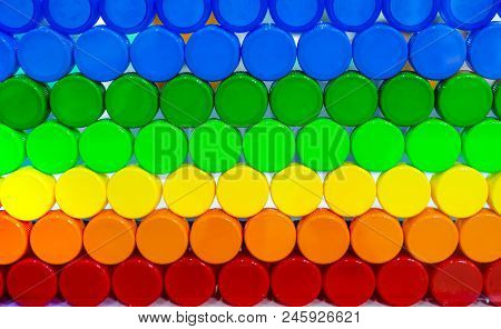 Colorful Plastic Bottle Cap Arrange With Beautiful Tone And Pattern. Blue, Green, Yellow, Orange, An