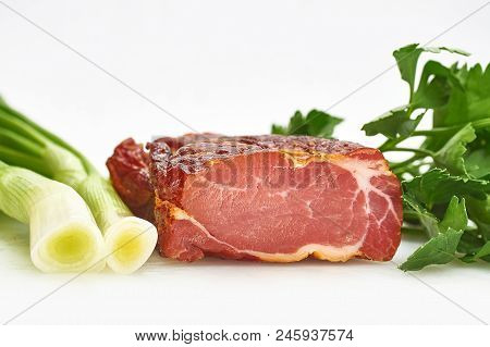 Pieces Of Pork Balyk With Fresh Green Lettuce On The White