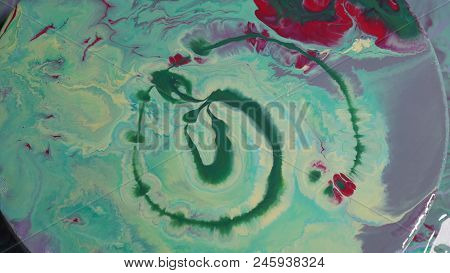 Painted Round Canvas In Green In Fluid Art Style