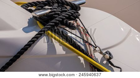 Dock Cleat On The Side Of A Boat In A Small Marina, An Element Of Yachting Equipment