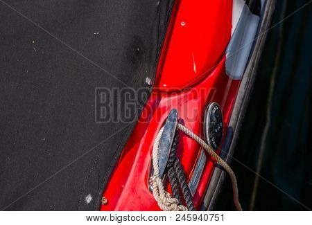 Dock Cleat On The Side Of A Boat In A Small Marina, An Element Of Yachting Equipment