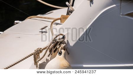 Dock Cleat On The Side Of A Boat In A Small Marina, An Element Of Yachting Equipment