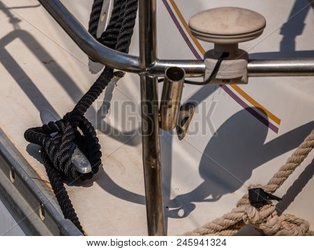 Dock Cleat On The Side Of A Boat In A Small Marina, An Element Of Yachting Equipment
