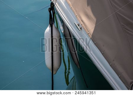 Dock Cleat On The Side Of A Boat In A Small Marina, An Element Of Yachting Equipment