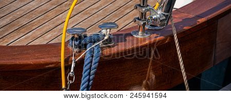 Dock Cleat On The Side Of A Boat In A Small Marina, An Element Of Yachting Equipment