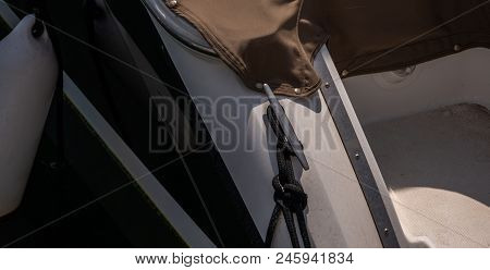 Dock Cleat On The Side Of A Boat In A Small Marina, An Element Of Yachting Equipment