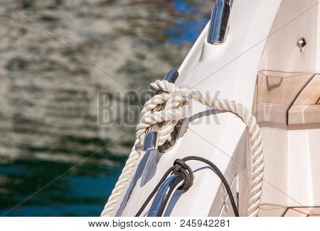 Dock Cleat On The Side Of A Boat In A Small Marina, An Element Of Yachting Equipment