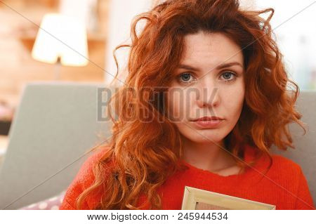Grey-eyed Woman. Grey-eyed Appealing Woman With Long Wavy Foxy Hair Feeling Brokenhearted After Bad 