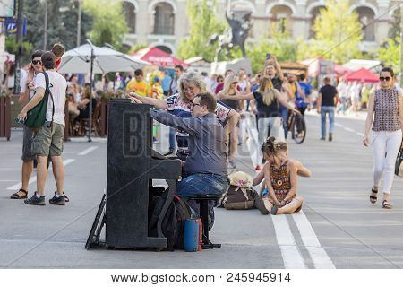 Kiev, Ukraine - May 05, 2018 : Ethno-fest : Traditions - Emotions - Life. Man And Woman At The Piano