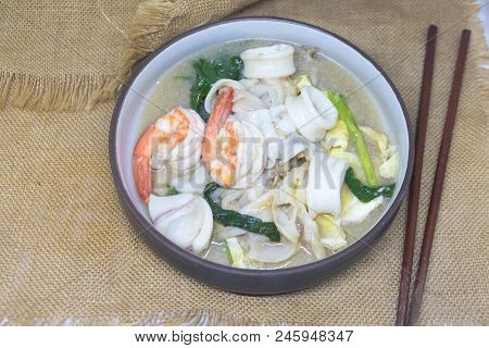 Fried Noodle With Egg, Squid And Shrimp Soaked Thai Style Food