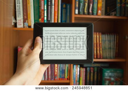 E-book In Man's Hand With Lorem Ipsum Text