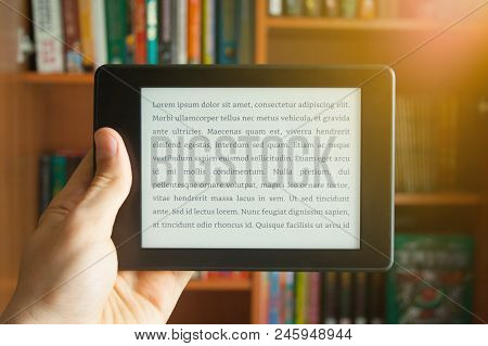 E-book In Man's Hand With Lorem Ipsum Text