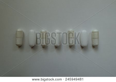 Caplets Of Calcium Citrate And Capsules Of Magnesium Citrate In A Row