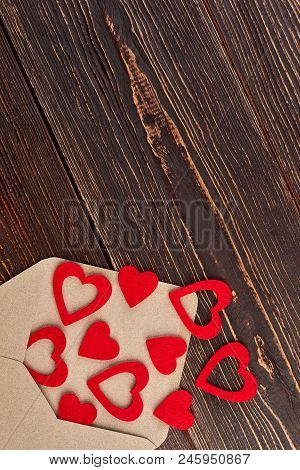 Many Red Hearts And Envelope, Top View. Envelope From Carft Paper And Red Hearts, Copy Space. Saint 