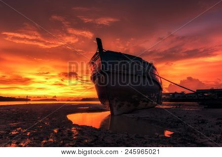 Vivid Twilight Sunset Or Sunrise Over The Sea And Old Fishing Boat On The Beach At Ranong Estuary, M