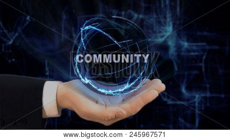 Painted Hand Shows Concept Hologram Community On His Hand. Drawn Man In Business Suit With Future Te