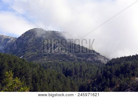 A View Of The Rocky Mountains In Serbia Against The Background Of Fog.