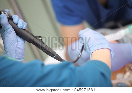 Daily Routine Treatment Procedure In The Icu Performing By Female Doctor And Male Assistant Nurse.