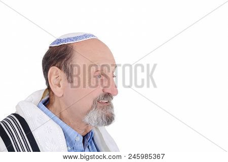Eldery Jewish Man With Kippah And Wrapped In Talit Praying. Religion Concept. Isolated White Backgro
