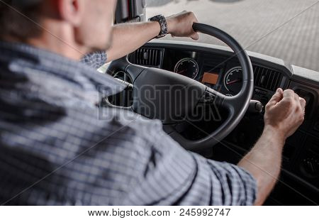 Transportation Industry Commercial Vehicle Driver. Caucasian Trucker Behind The Wheel.