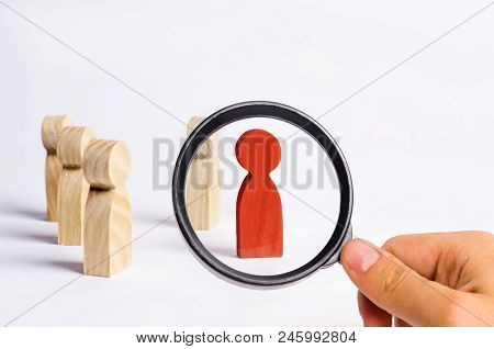 A Man Stands In The Crowd And Looks The Other Way On A White Background. Concept Meeting Rally. Anot