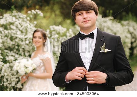Handsome Groom Staind In Front Of Beutiful Bride