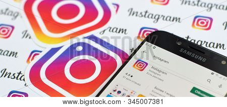 Instagram App On Samsung Smartphone Screen On Banner With Small Instagram Logos. Instagram Is Americ