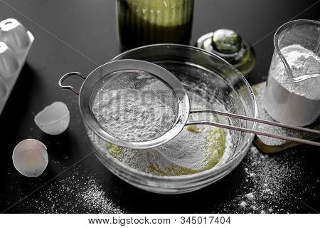 Ingredients For Home Baking: Cookies, Bread, Cake. Flour, Sugar, And Eggs Are On The Black Table. Ba
