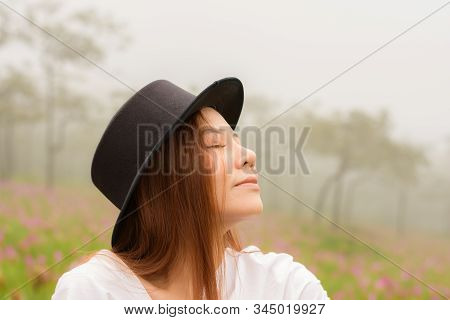 Portrait Of A Woman Relaxing In The Garden Siam Tulip