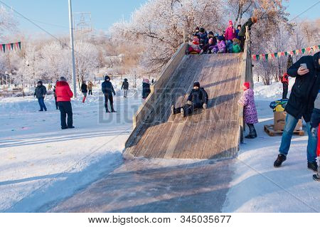 Novokuznetsk, Russia- January 07, 2019: Russian Winter Entertainment: Children Having Fun Tobogganin